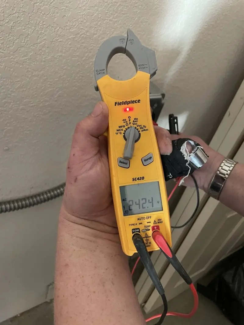 Voltage testing with clamp meter during Ceiling Fan Installation in Savage